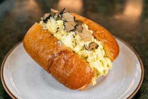 Bun or bread with scrambled eggs and truffle mushroom photo