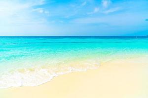 Empty beautiful tropical beach sea and blue sky for background photo