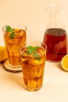 Glass of ice lemon tea with mint photo