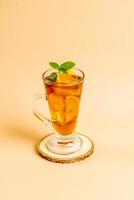 Glass of ice lemon tea with mint photo