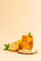 Glass of ice lemon tea with mint photo