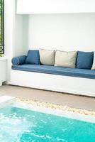 Comfortable pillow decorate on sofa around swimming pool photo