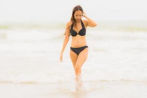 Portrait beautiful young asian woman wear bikini on the beach sea ocean photo