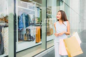 Portrait beautiful young asian woman happy and smile with shopping bag from department store photo