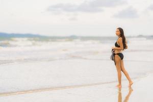 Portrait beautiful young asian woman wear bikini on the beach sea ocean photo