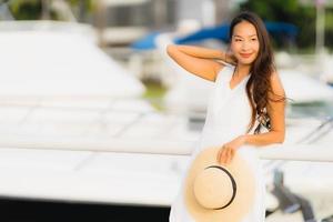 Portrait beautiful young asian woman leisure smile happy relax around yacht port photo