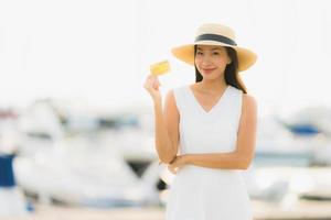 Portrait beautiful young asian woman leisure smile happy relax around yacht port photo