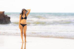 Portrait beautiful young asian woman wear bikini on the beach sea ocean photo