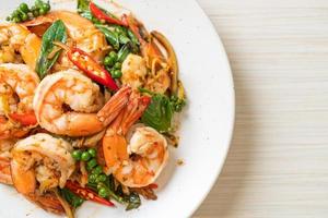 Stir-fried holy basil with shrimps and herb - Asian food style photo