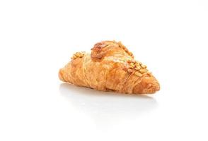 Fresh croissant with peanut on plate photo