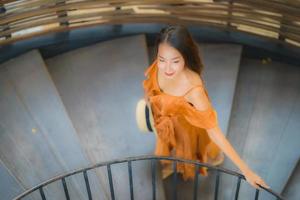 Portrait beautiful young asian woman walk on circle stair photo