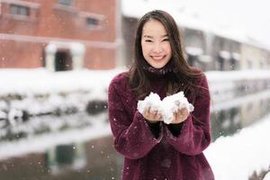 Beautiful young asian woman smile and happy with travel trip in Otaru canal Hokkaido Japan photo