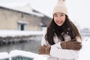 Beautiful young asian woman smile and happy with travel trip in Otaru canal Hokkaido Japan photo