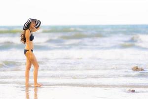 Portrait beautiful young asian woman wear bikini on the beach sea ocean photo