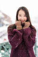 Beautiful young asian woman smile and happy with travel trip in Otaru canal Hokkaido Japan photo