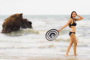 Portrait beautiful young asian woman wear bikini on the beach sea ocean photo