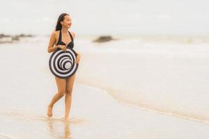 Portrait beautiful young asian woman wear bikini on the beach sea ocean photo