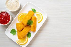 Fried fish finger sticks or french fries fish with sauce photo