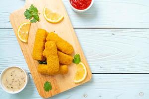 Fried fish finger sticks or french fries fish with sauce photo