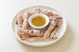 Steamed crayfish or mantis shrimps or stomatopods with spicy seafood sauce photo
