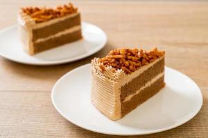 Homemade coffee almonds cake on white plate photo