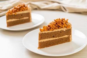 Homemade coffee almonds cake on white plate photo