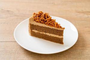 Homemade coffee almonds cake on white plate photo