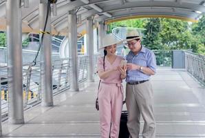 Elderly Asian couple is traveling Concept Holiday travel photo