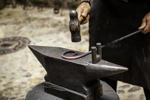 Iron incandescent in an old metal forge photo