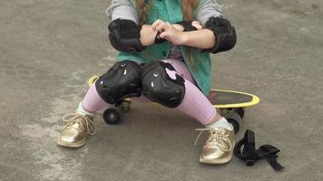 Little girl dresses protection helmet knee pads and elbow pads Sunset video
