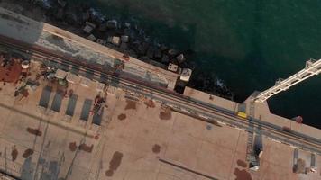 Flying over the marina and cargo port for ships in the sea Aerial shot video