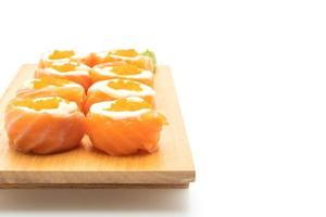 Fresh salmon sushi roll with mayonnaise and shrimp egg - Japanese food style photo