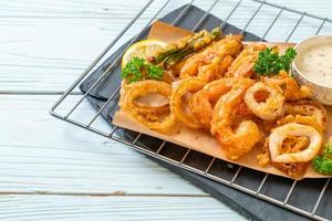 Deep-fried seafood, shrimp and squid with mix vegetables - unhealthy food style photo