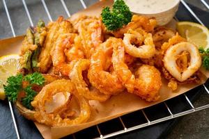 Deep-fried seafood, shrimp and squid with mix vegetables - unhealthy food style