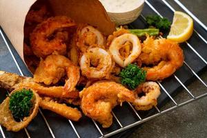 Deep-fried seafood, shrimp and squid with mix vegetables - unhealthy food style