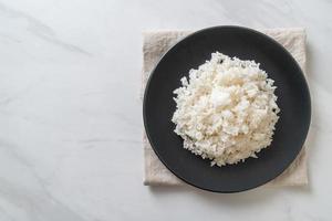 Cooked Thai jasmine white rice on plate photo