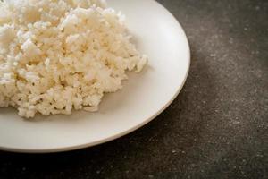 Cooked Thai jasmine white rice on plate photo