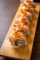 Grilled salmon sushi roll with sauce - Japanese food style photo