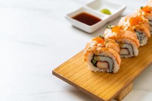 Grilled salmon sushi roll with sauce - Japanese food style