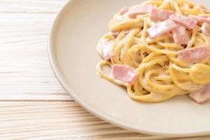 Homemade spaghetti white cream sauce with ham - Italian food style photo