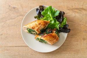 Baked chicken breast stuffed with cheese and spinach photo