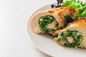 Baked chicken breast stuffed with cheese and spinach photo