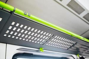 Metal shelf for luggage in a train carriage - empty carriage without passengers - space for a bag and suitcase photo