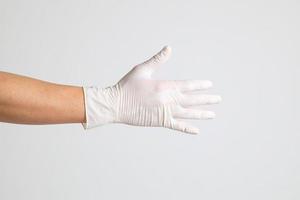 mano con guantes médicos foto