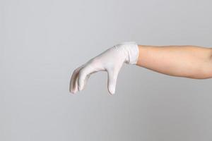 mano con guantes médicos foto