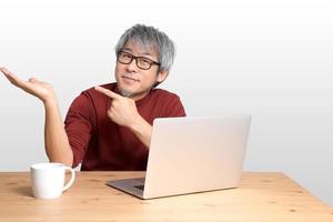 Asian Man Sitting photo