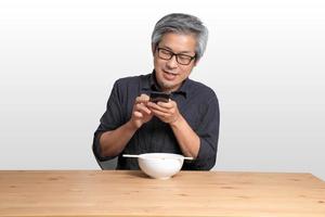 Asian Man Sitting photo