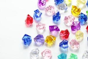 Colorful gems background, blue red green yellow white crystals photo