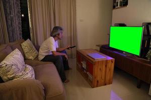 Asian Man Watching Television photo