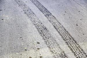 Wheel tracks on street photo